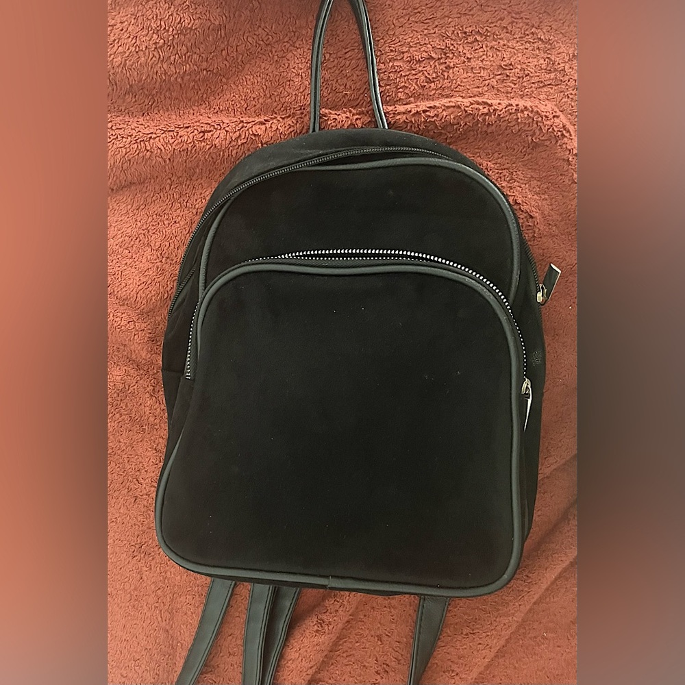 Mini black velvet backpack purse.